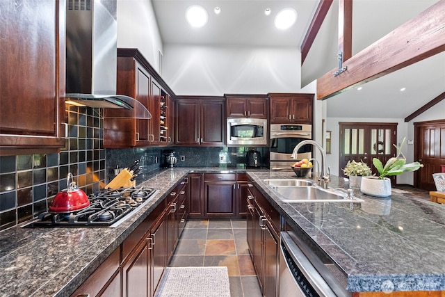 931 SW Moose Hill Ct, Port Orchard, WA 98367 - kitchen featuring stainless steel appliances, wall chimney exhaust hood, tasteful backsplash, high vaulted ceiling, and a kitchen island with sink