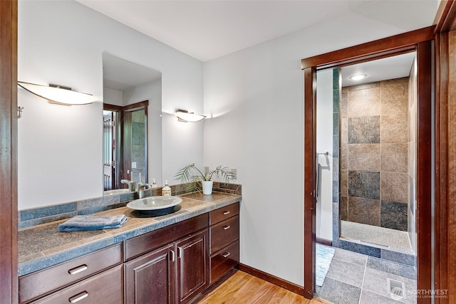 931 SW Moose Hill Ct, Port Orchard, WA 98367 - bathroom with vanity, tiled shower, and wood finished floors