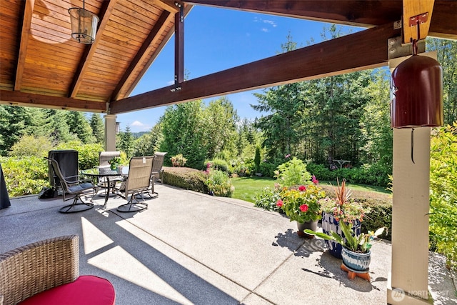 931 SW Moose Hill Ct, Port Orchard, WA 98367 - view of patio with outdoor dining space and view of wooded area