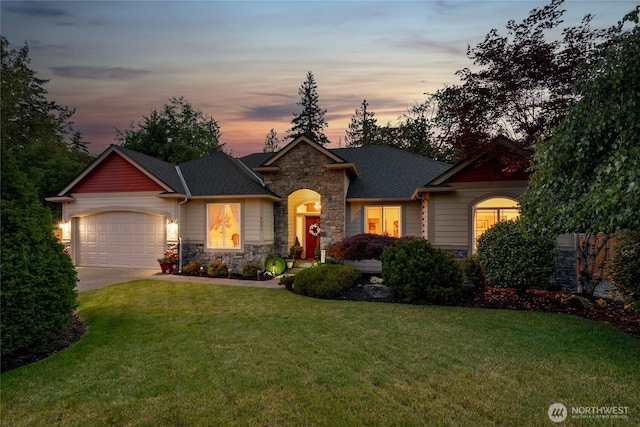 8206 66th Avenue Ct E, Puyallup, WA 98371 - craftsman-style house featuring stone siding, concrete driveway, a front lawn, and a garage