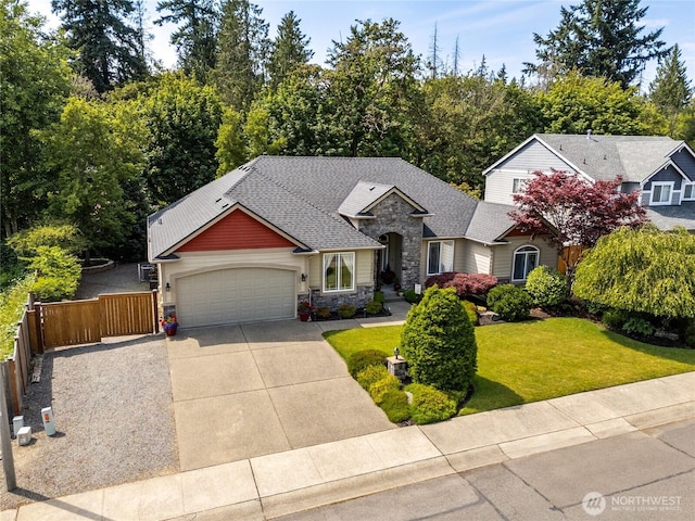 8206 66th Avenue Ct E, Puyallup, WA 98371 - craftsman house featuring stone siding, driveway, a garage, and a shingled roof