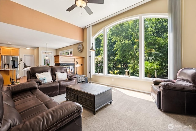 8206 66th Avenue Ct E, Puyallup, WA 98371 - living area with a ceiling fan, light colored carpet, and a glass covered fireplace