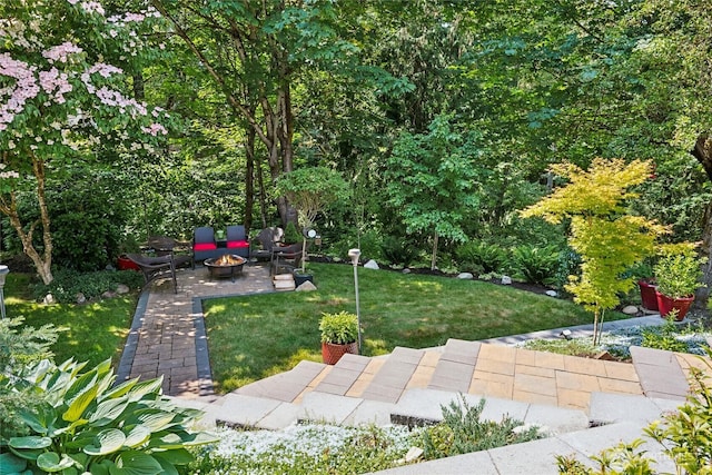 8206 66th Avenue Ct E, Puyallup, WA 98371 - view of grassy yard with a fire pit