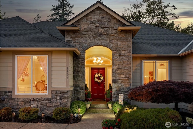 8206 66th Avenue Ct E, Puyallup, WA 98371 - view of front of home featuring stone siding and a shingled roof