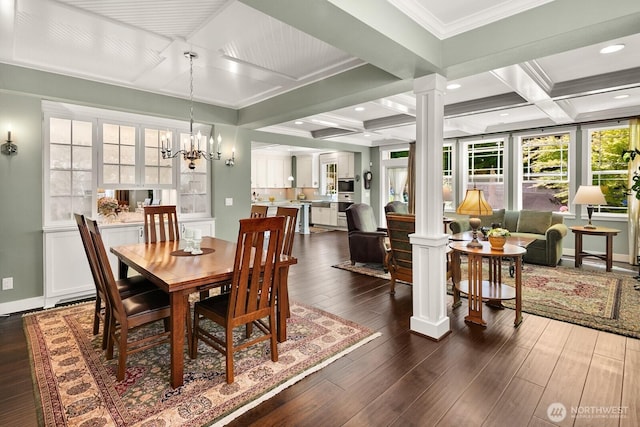 3913 W Briarcliff Ln, Seattle, WA 98199 - dining room featuring decorative columns, coffered ceiling, a chandelier, beam ceiling, and dark wood-style flooring
