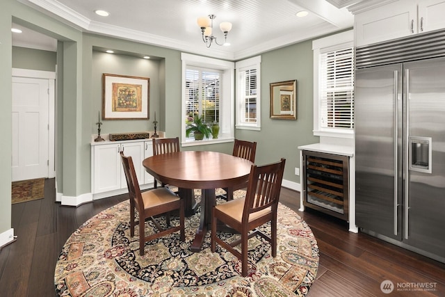 3913 W Briarcliff Ln, Seattle, WA 98199 - dining room featuring beverage cooler, ornamental molding, dark wood finished floors, recessed lighting, and a chandelier