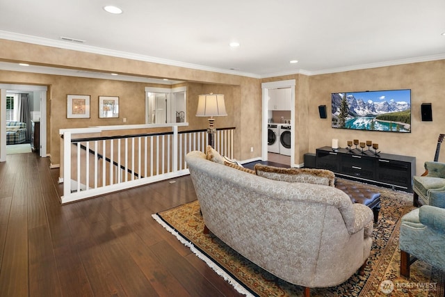 3913 W Briarcliff Ln, Seattle, WA 98199 - living room with separate washer and dryer, hardwood / wood-style floors, recessed lighting, and crown molding