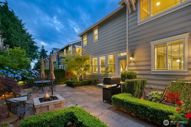 3913 W Briarcliff Ln, Seattle, WA 98199 - view of patio / terrace with an outdoor fire pit and area for grilling