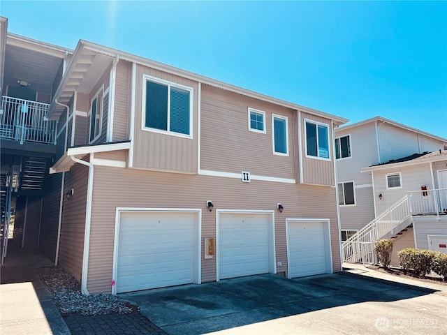 14915 38th Dr SE Unit Ii2051, Bothell, WA 98012 - back of property with an attached garage, driveway, and stairway