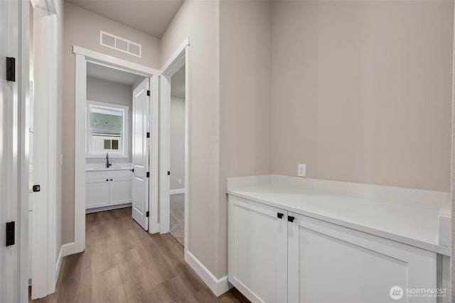 13620 100th St NE Unit 211, Lake Stevens, WA 98258 - hallway featuring light wood-style floors and baseboards