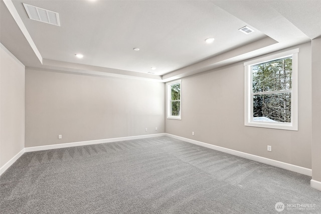 13620 100th St NE Unit 211, Lake Stevens, WA 98258 - spare room featuring a tray ceiling, carpet, and recessed lighting