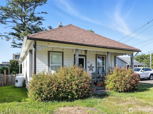 1205 49th St, Seaview, WA 98644 - bungalow featuring roof with shingles and covered porch