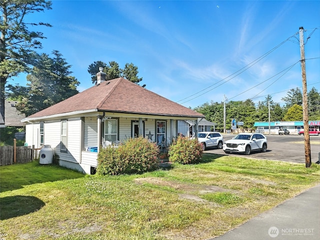 1205 49th St, Seaview, WA 98644 - view of front of home featuring covered porch, a shingled roof, and uncovered parking