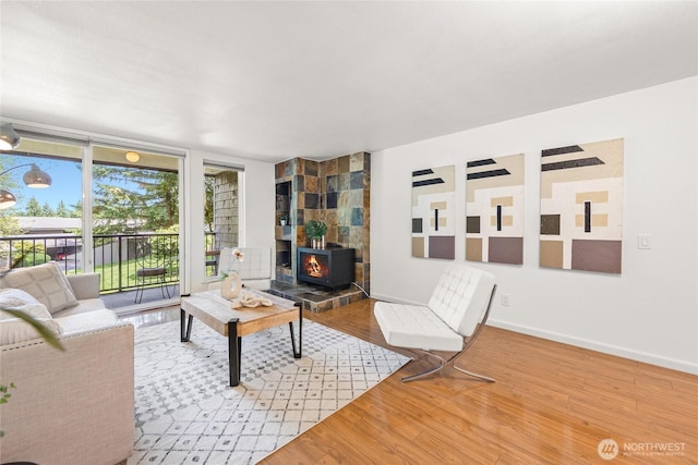 6347 137th Ave NE Unit 262, Redmond, WA 98052 - living area with a wood stove and wood finished floors
