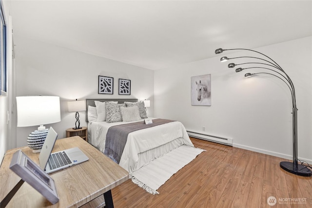 6347 137th Ave NE Unit 262, Redmond, WA 98052 - bedroom featuring baseboard heating and wood finished floors