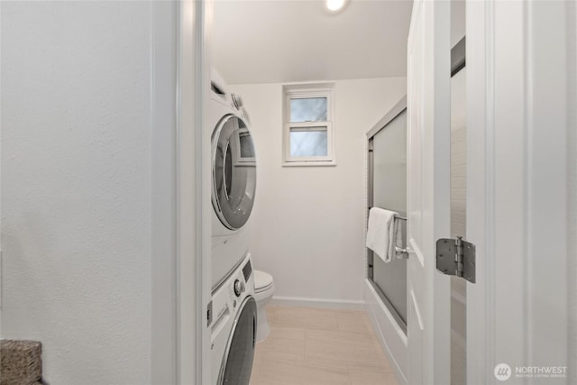 6347 137th Ave NE Unit 262, Redmond, WA 98052 - washroom with stacked washer and clothes dryer and baseboards