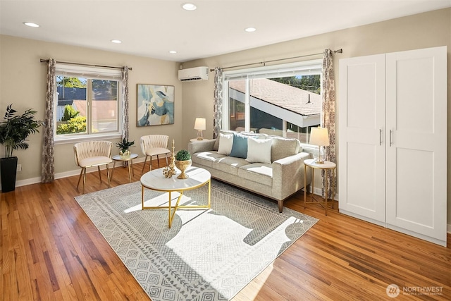 13316 30th Ave NE, Seattle, WA 98125 - living room with a wall unit AC, healthy amount of natural light, light wood-style floors, and recessed lighting