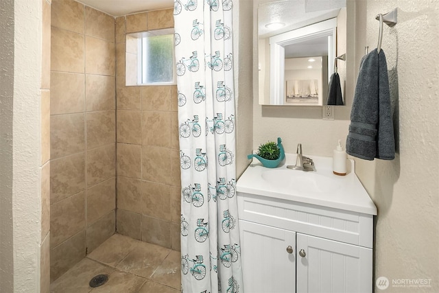 13316 30th Ave NE, Seattle, WA 98125 - full bathroom featuring tiled shower, vanity, and a textured wall