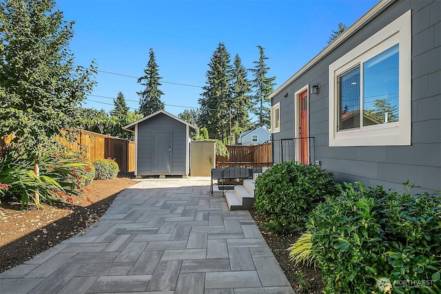 13316 30th Ave NE, Seattle, WA 98125 - fenced backyard featuring a storage shed and a patio
