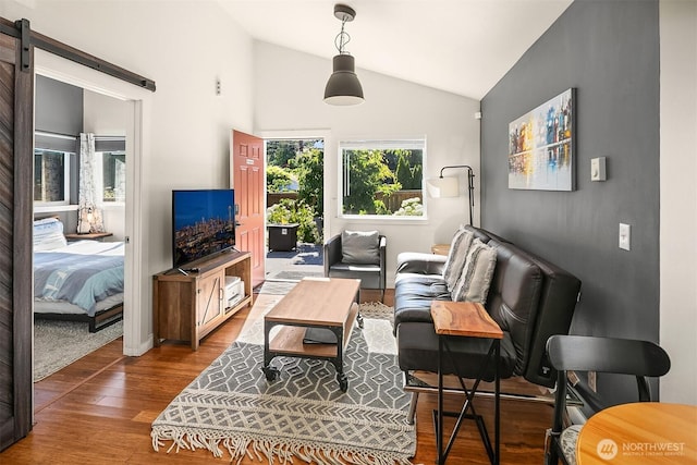 13316 30th Ave NE, Seattle, WA 98125 - living room with lofted ceiling, wood finished floors, and a barn door