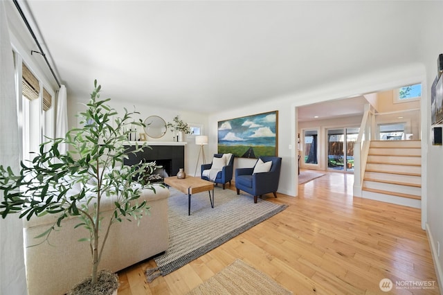 533 Craig St, Walla Walla, WA 99362 - living room with a fireplace, stairs, hardwood / wood-style flooring, and healthy amount of natural light