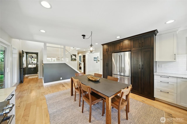 533 Craig St, Walla Walla, WA 99362 - dining room with stairway, light wood-type flooring, and recessed lighting