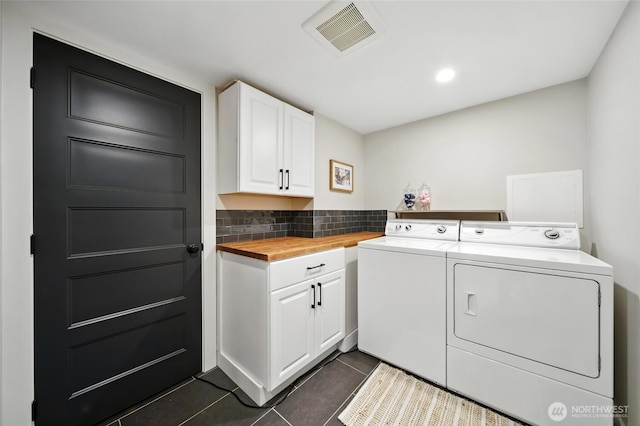 533 Craig St, Walla Walla, WA 99362 - laundry room featuring washing machine and dryer, dark tile patterned floors, cabinet space, and recessed lighting