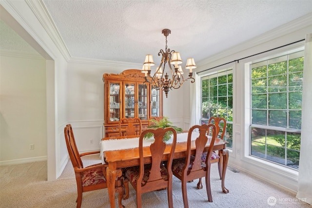 1800 SE 202nd Ave, Camas, WA 98607 - carpeted dining space featuring ornamental molding, a textured ceiling, and a chandelier