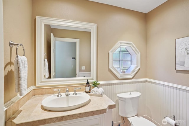1800 SE 202nd Ave, Camas, WA 98607 - half bathroom featuring vanity and a wainscoted wall