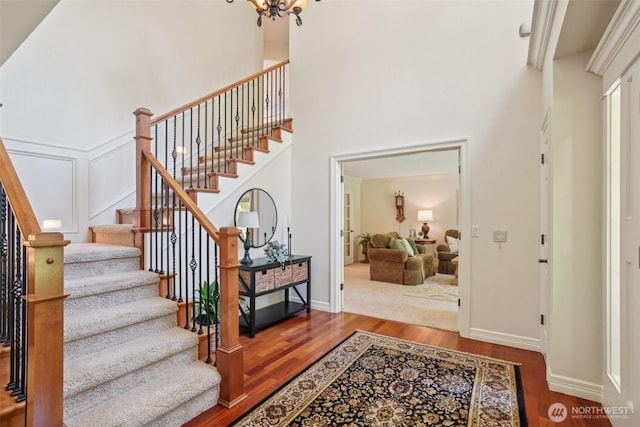 1800 SE 202nd Ave, Camas, WA 98607 - entrance foyer with wood finished floors, stairway, a chandelier, and a high ceiling
