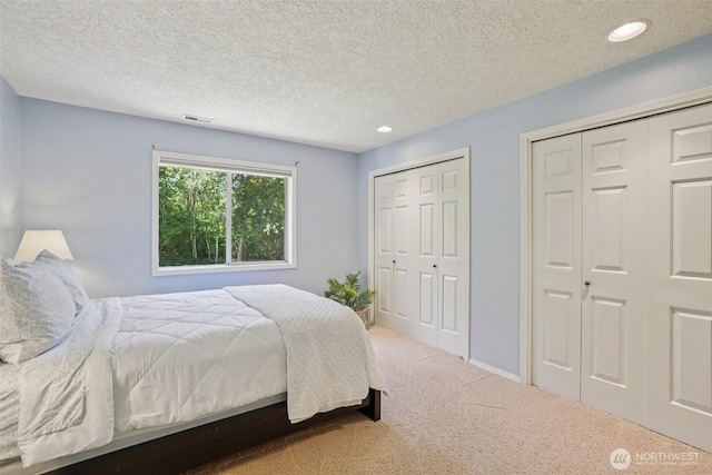 1800 SE 202nd Ave, Camas, WA 98607 - bedroom featuring carpet, multiple closets, recessed lighting, and a textured ceiling