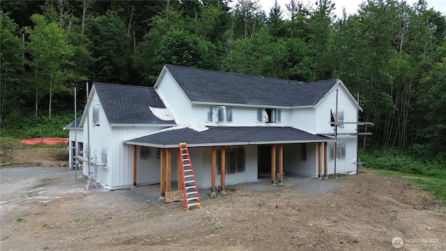 40440 306th Ave SE, Enumclaw, WA 98022 - view of front facade featuring a shingled roof and a wooded view