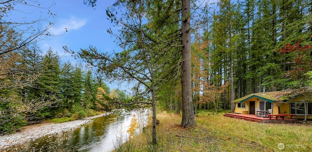 44111 SE Mt Si Rd, North Bend, WA 98045 - view of yard with a deck with water view and a view of trees