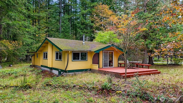 44111 SE Mt Si Rd, North Bend, WA 98045 - rear view of house featuring a deck and a view of trees