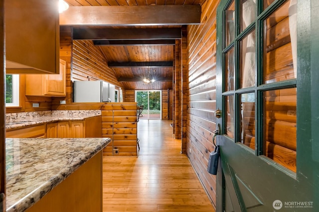 44111 SE Mt Si Rd, North Bend, WA 98045 - kitchen featuring wood ceiling, wood walls, light wood finished floors, light stone countertops, and light brown cabinets