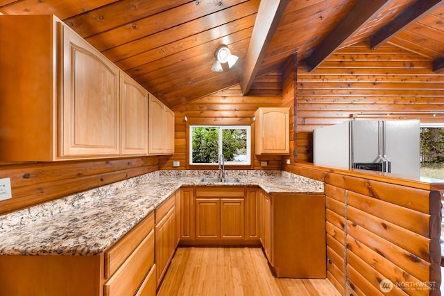 44111 SE Mt Si Rd, North Bend, WA 98045 - kitchen featuring white refrigerator with ice dispenser, light wood finished floors, healthy amount of natural light, light stone countertops, and wood ceiling