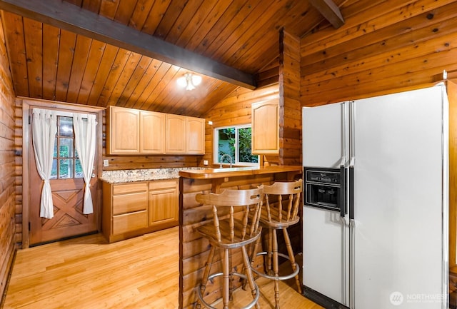 44111 SE Mt Si Rd, North Bend, WA 98045 - kitchen with white fridge with ice dispenser, light wood-style flooring, wood ceiling, wooden walls, and a kitchen breakfast bar