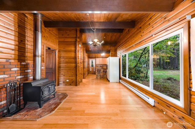 44111 SE Mt Si Rd, North Bend, WA 98045 - hallway with a baseboard radiator, a chandelier, a wood ceiling with exposed beams, wood walls, and light wood finished floors