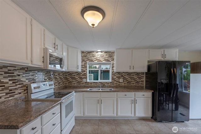 31108 3rd Ave Unit 330, Black Diamond, WA 98010 - kitchen with white appliances, white cabinets, and decorative backsplash