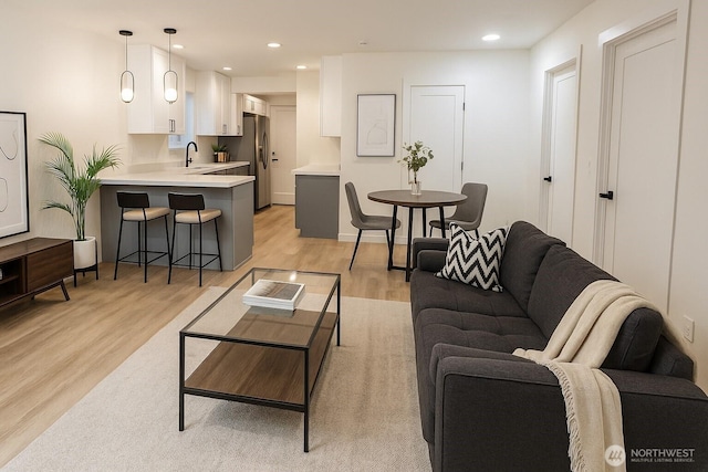744 N 88th St, Seattle, WA 98103 - living area featuring light wood finished floors and recessed lighting