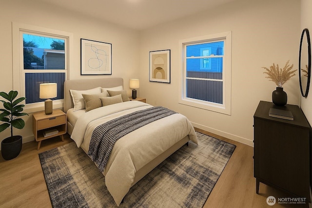 744 N 88th St, Seattle, WA 98103 - bedroom with baseboards and wood finished floors