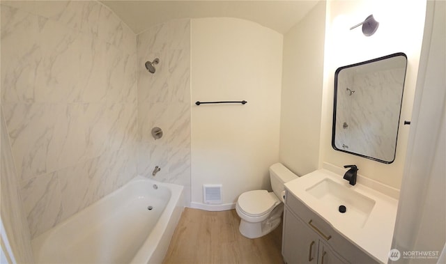 744 N 88th St, Seattle, WA 98103 - full bath with wood finished floors, vanity, bathtub / shower combination, and vaulted ceiling