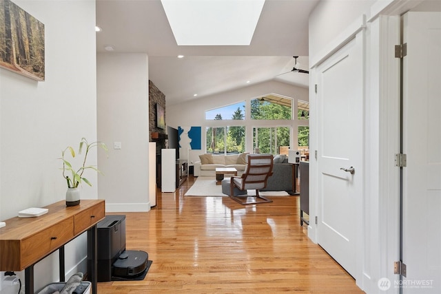 1738 Lilypad Pl E, Port Orchard, WA 98366 - living room featuring vaulted ceiling, light wood-style flooring, a skylight, and recessed lighting