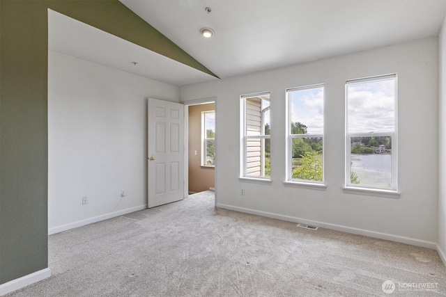 2311 Milton Way Unit E, Milton, WA 98354 - empty room featuring carpet and vaulted ceiling