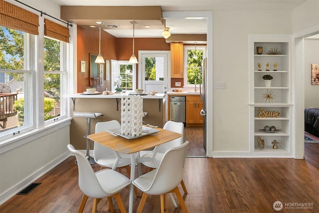 4521 47th Ave SW, Seattle, WA 98116 - dining area with dark wood-type flooring and baseboards
