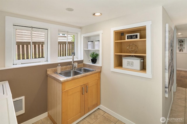 4521 47th Ave SW, Seattle, WA 98116 - kitchen with open shelves, light tile patterned floors, light brown cabinets, recessed lighting, and light countertops