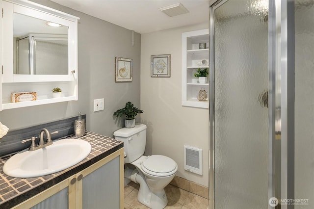 4521 47th Ave SW, Seattle, WA 98116 - bathroom featuring a shower stall, tile patterned floors, vanity, and heating unit