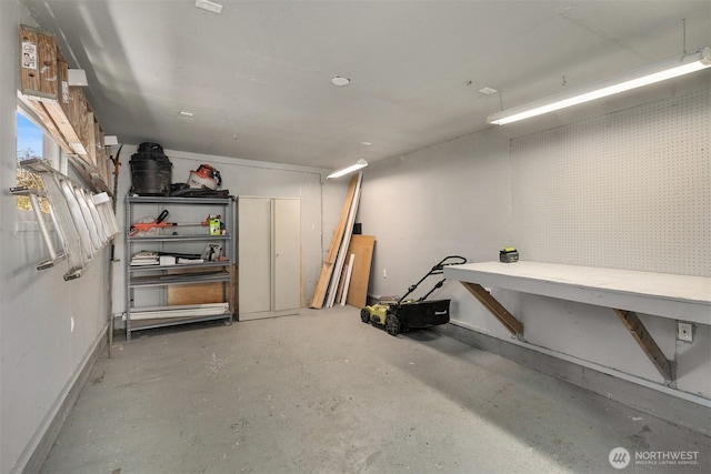 4521 47th Ave SW, Seattle, WA 98116 - basement featuring a workshop area and baseboards