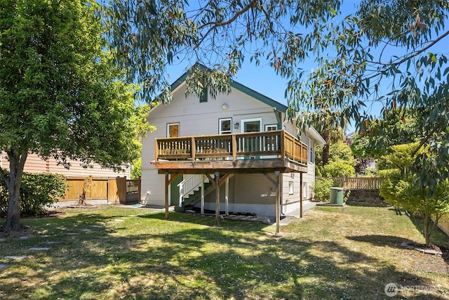 4521 47th Ave SW, Seattle, WA 98116 - rear view of property with stairs, a deck, and a fenced backyard