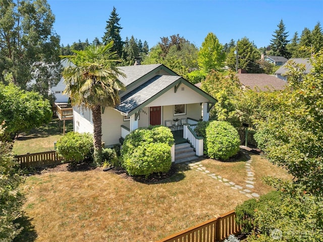 4521 47th Ave SW, Seattle, WA 98116 - view of front of house featuring a shingled roof and a porch
